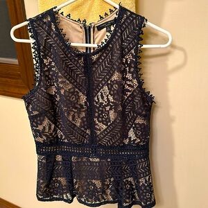 Navy lace top with nude lining.